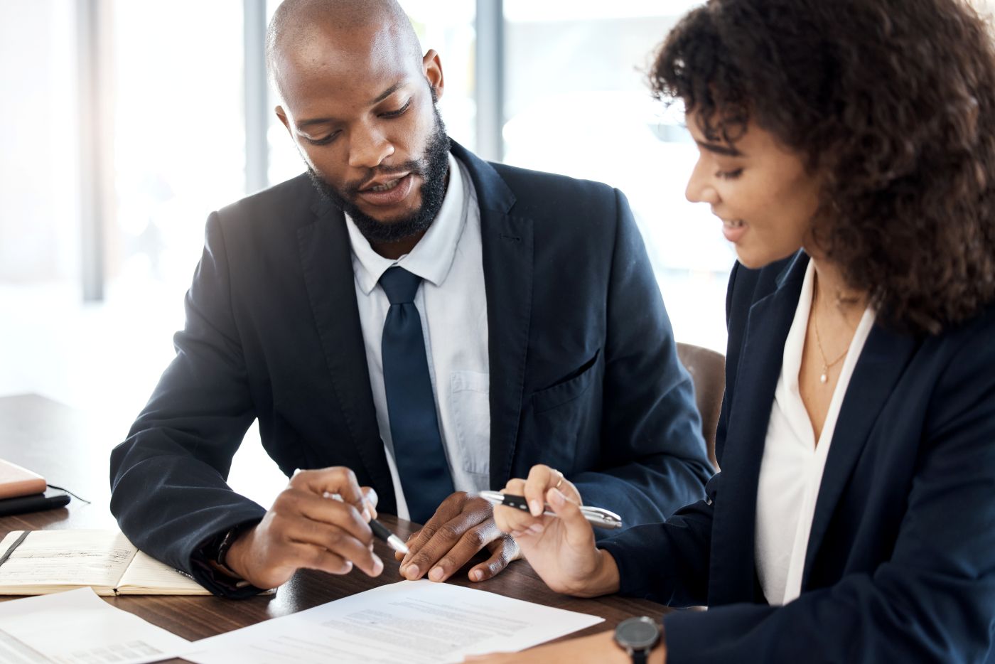 Surety bond expert reviewing Massachusetts bonding options with a small business owner