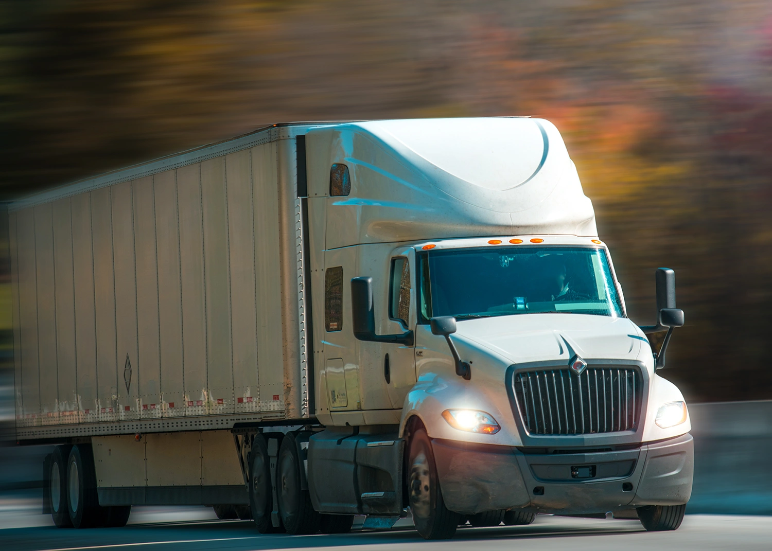 semi truck driving up road