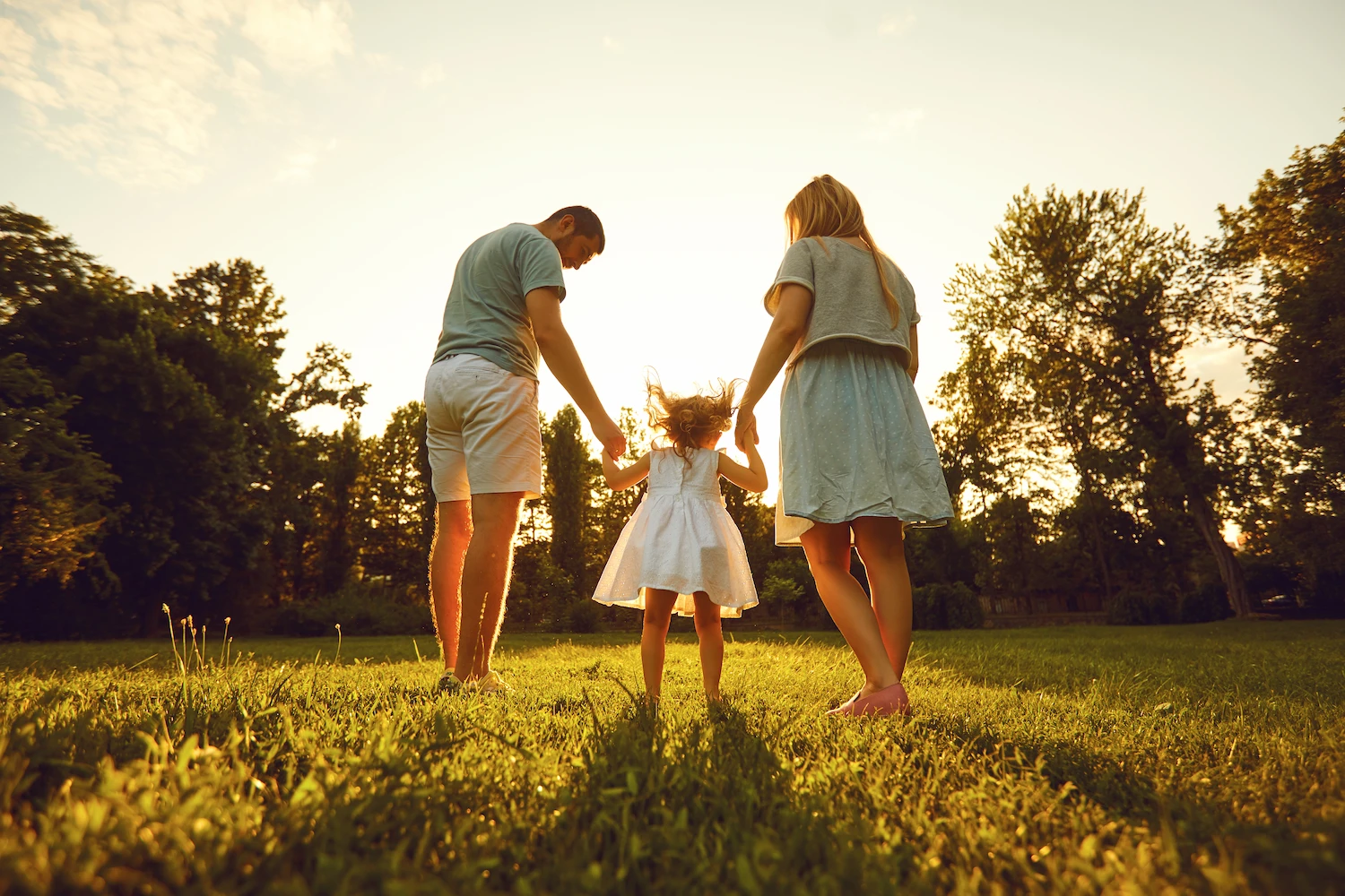 happy family walking in their yard